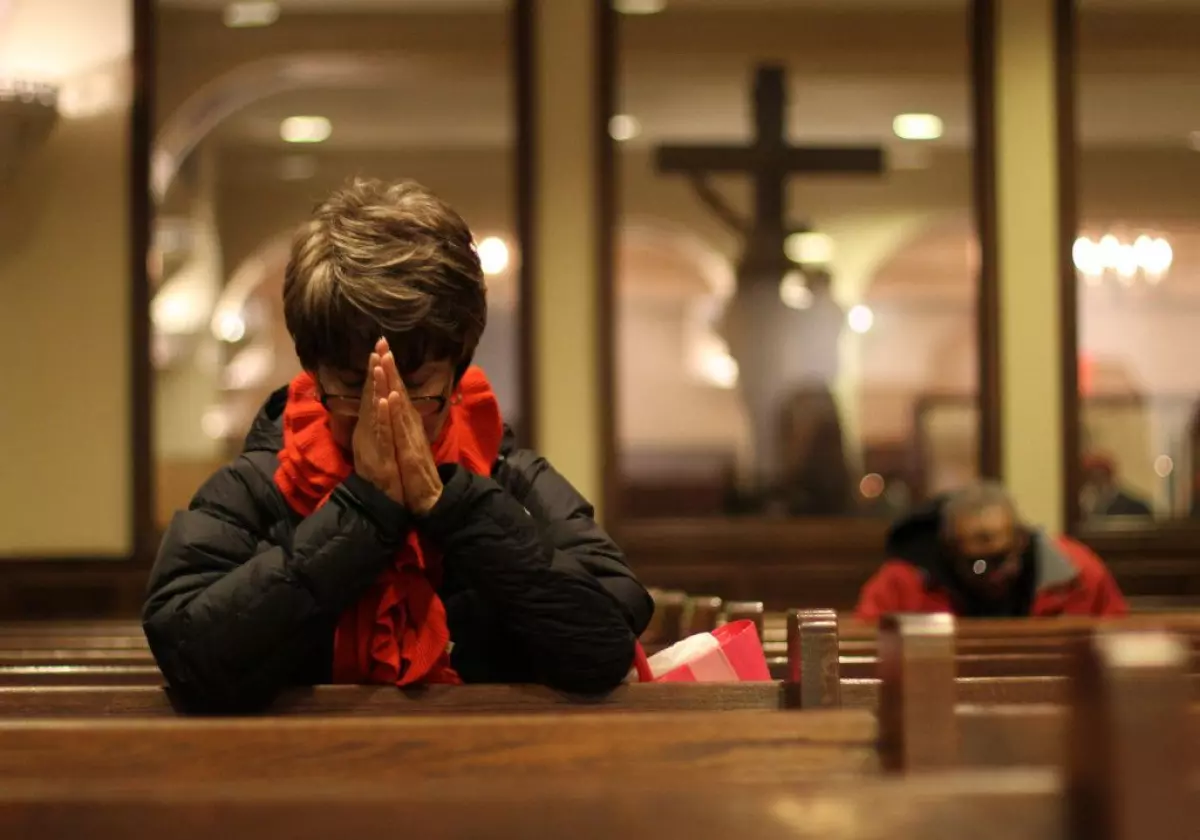 A woman prays during a 2013 Ash Wednesday Mass at St. Francis of Assisi Church in New York. Catholics are called on to reinvigorate their lives of prayer during the season of Lent. (CNS photo/Gregory A. Shemitz) See MIDST March 2, 2015.