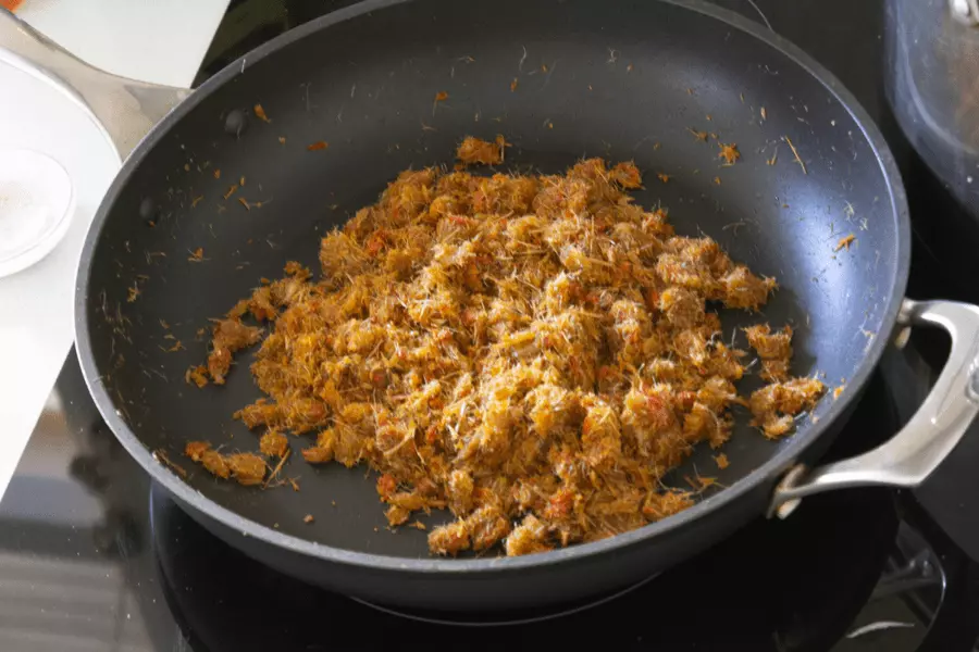 Cabbage and carrot chunks in a pot with shiitake and lion's mane mushrooms