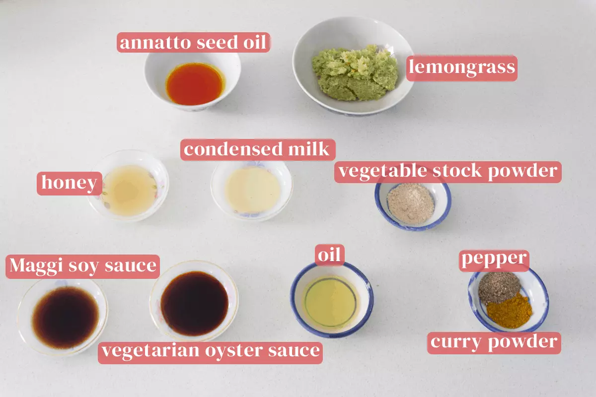 Dishes of annatto seed oil, blizted lemongrass, vegetable stock powder, condensed milk, oil, soy sauce, vegetarian oyster sauce, pepper and curry powder.